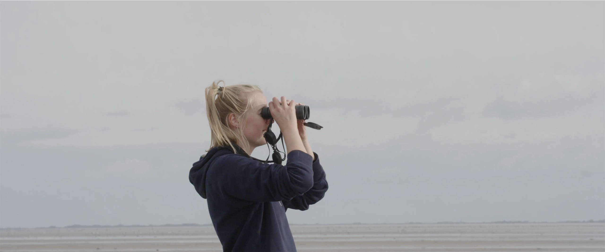 Image of a girl looking through binoculars .jpg